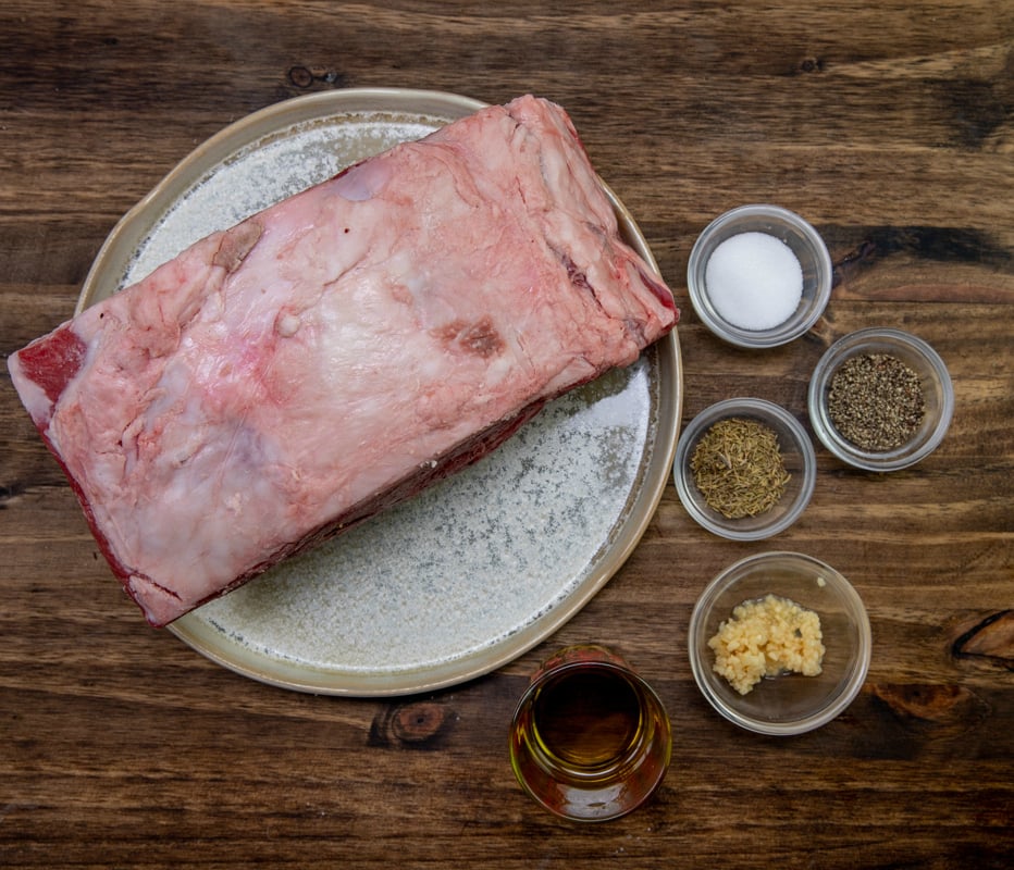 The Best Prime Rib - raw prime rib on plate with seasoning