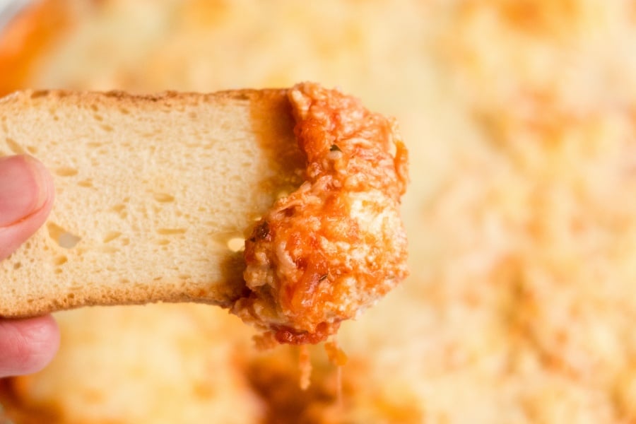 Chicken Parmesan Dip - dipping with toasted bread