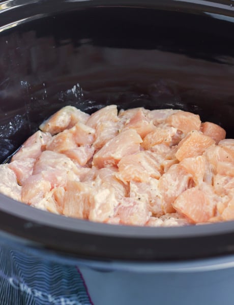 Crockpot Cashew Chicken - coated chicken pieces in the slow cooker