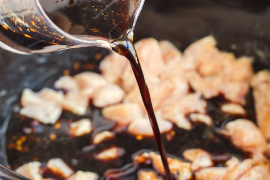 Crockpot Cashew Chicken - showing how to make cashew chicken, pouring the sauce into the slow cooker