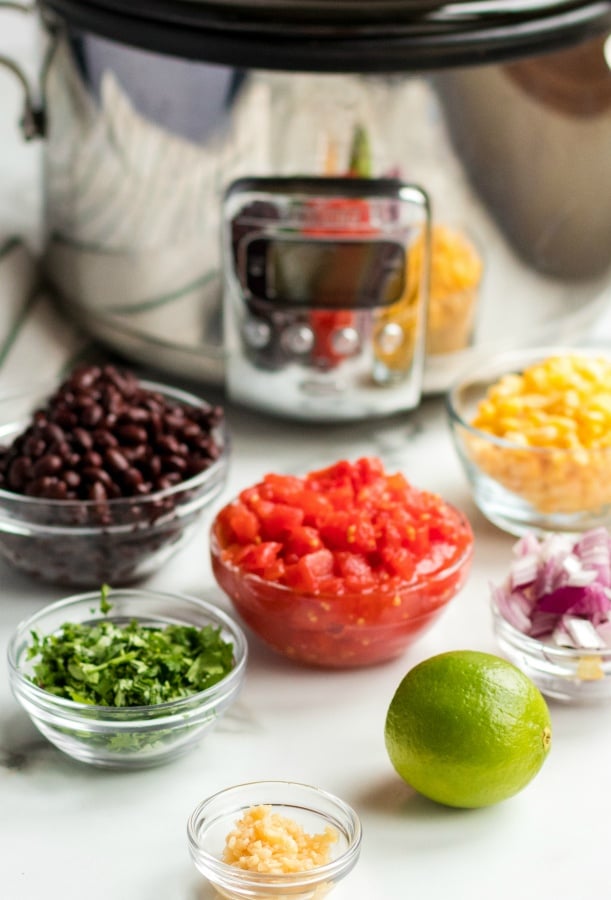 Crockpot Cilantro Lime Chicken - ingredients in bowls, black beans, diced tomatoes, corn, onions, cilantro, and minced garlic