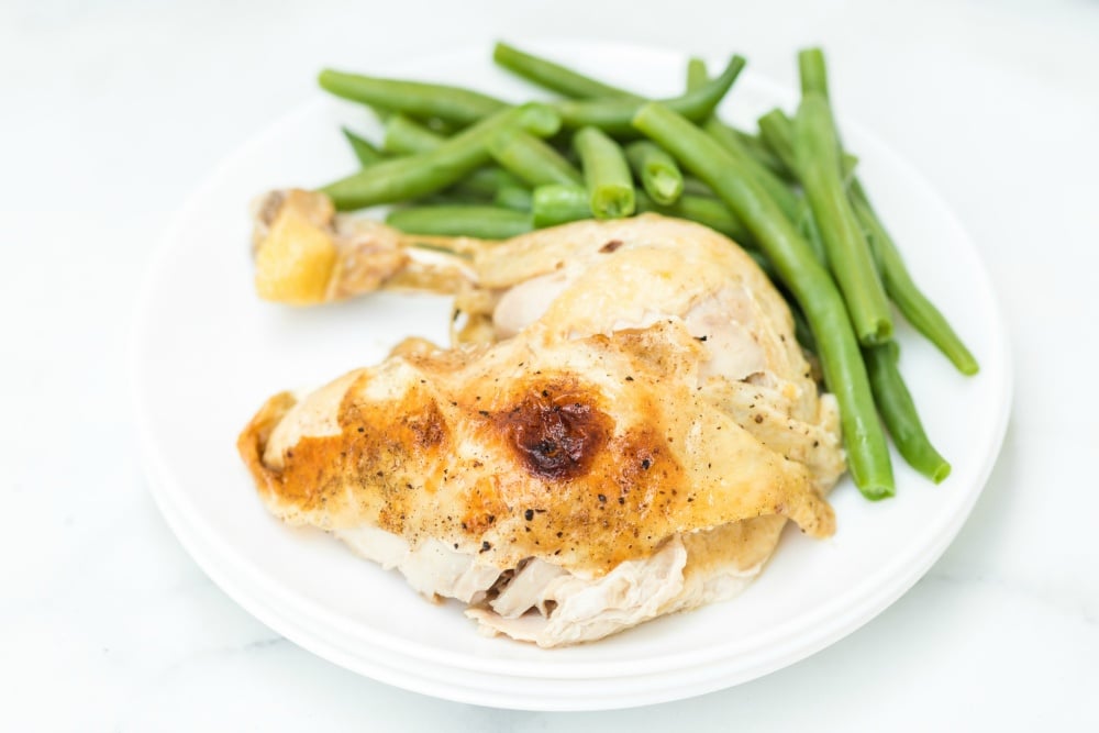 Instant Pot Dill Pickle Chicken - serving of chicken served on a white plate with green beans