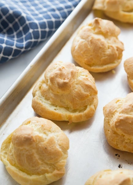 Easy Cream Puff Recipe - baked pastries on baking sheet