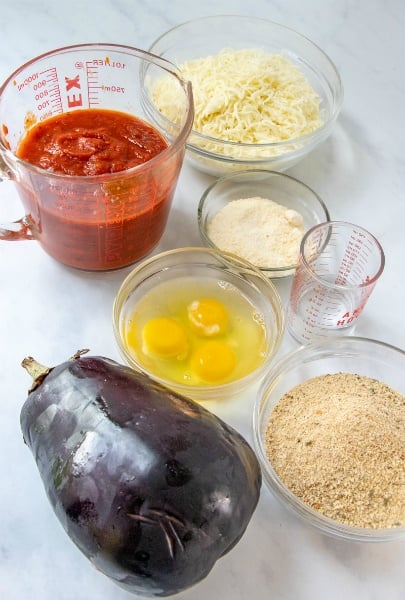 Eggplant, marinara sauce, cheese, eggs, and bread crumbs.