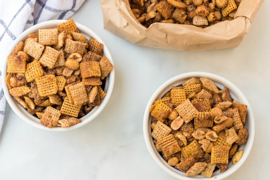 Churro chex mix served in two small bowls