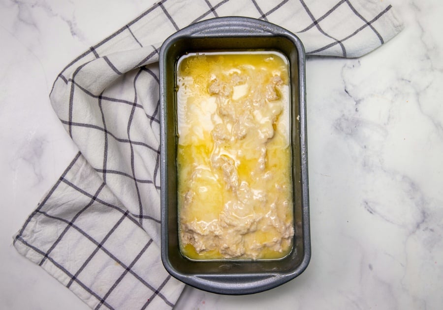 Easy No Yeast Beer Bread - batter in bread loaf pan, and topped with melted butter