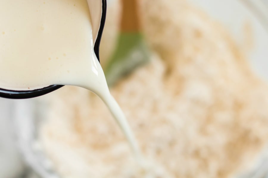 pouring cold buttermilk into flour mixture