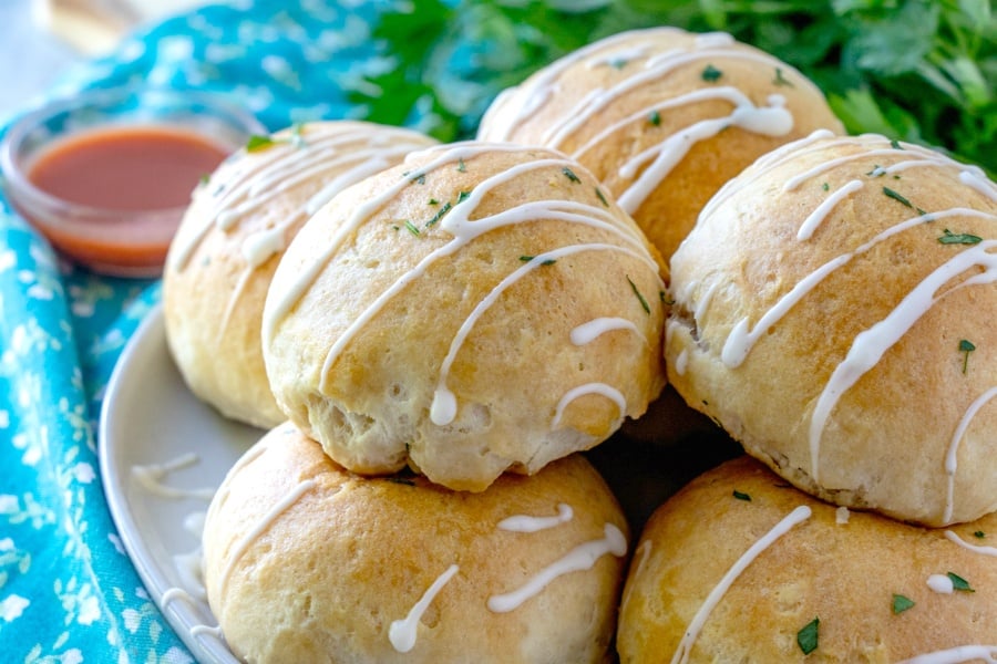 Buffalo Chicken Bombs - buffalo chicken bombs on a plate and drizzled with ranch dressing