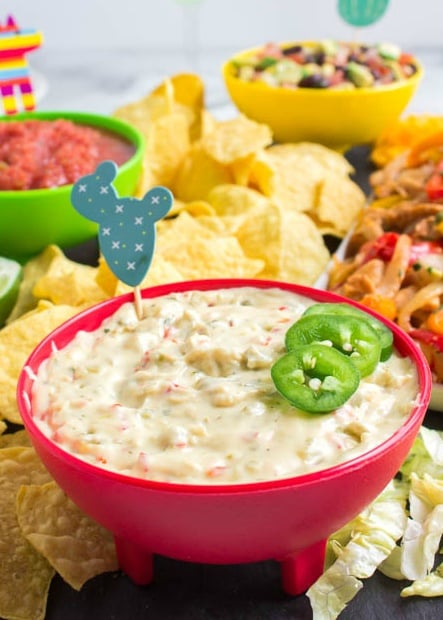 Cinco De Mayo Appetizer Board - cheese dip served in a red bowl