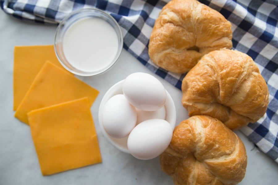 Eggs, croissants and sliced cheese