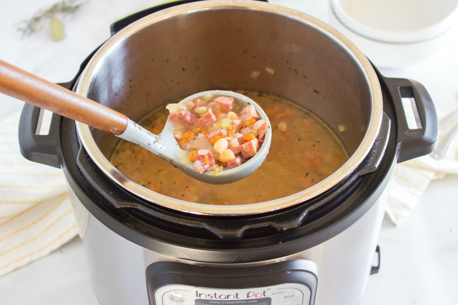 Soup being scooped up with a ladle