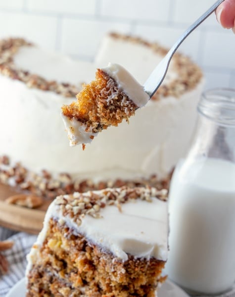 The Best Carrot Cake Recipe - fork picking up a piece of cake