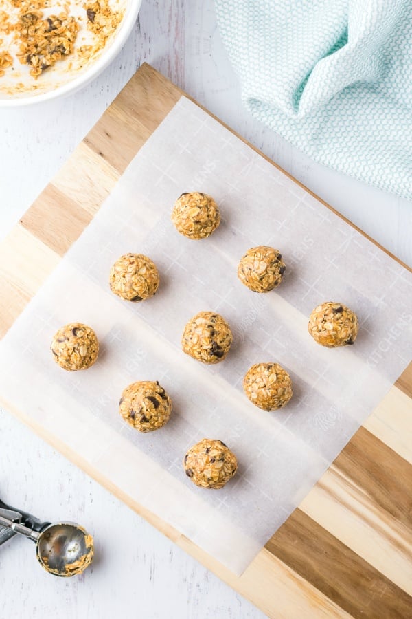 Energy bites lined up on parchment paper