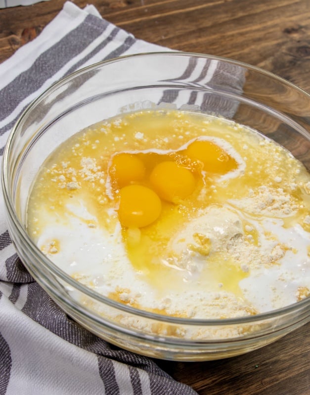 Cake batter ingredients in a large glass bowl