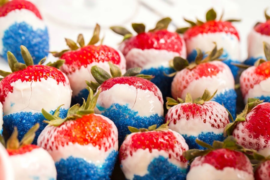 Close up image of red, white and blue chocolate covered strawberries