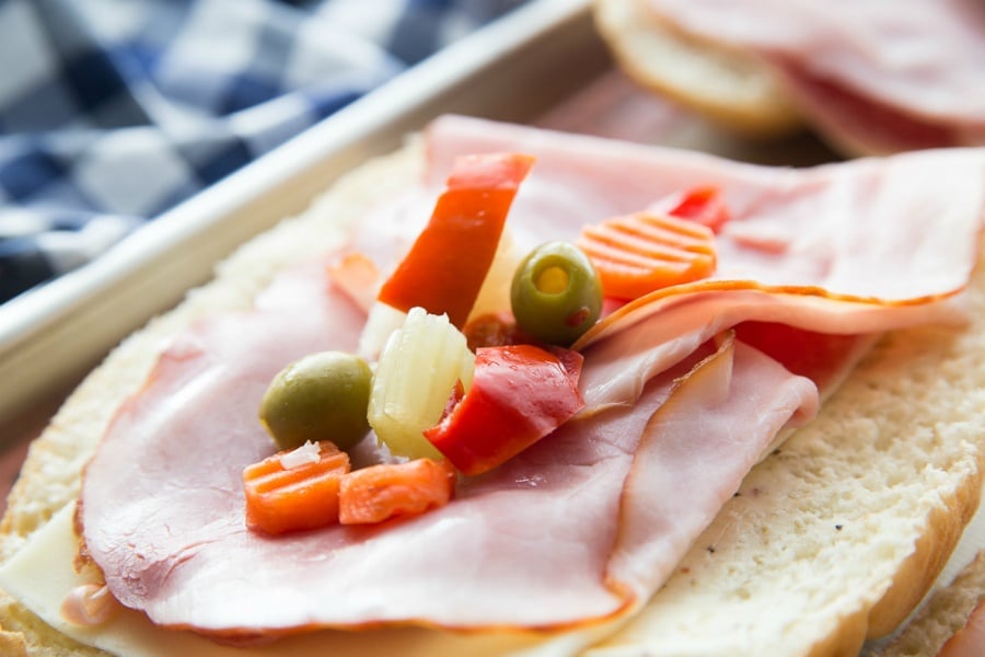 giardiniera placed on top of hoagie rolls