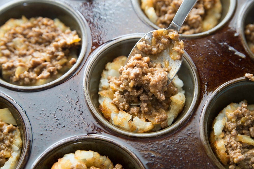 placing beef mixture into tater tot cups