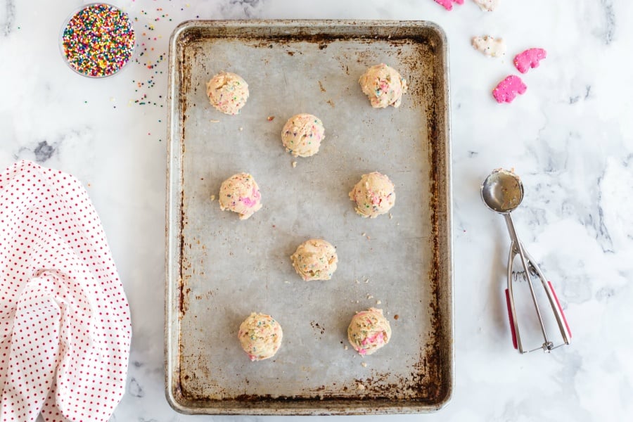 Cookie batter balls, on a baking pan