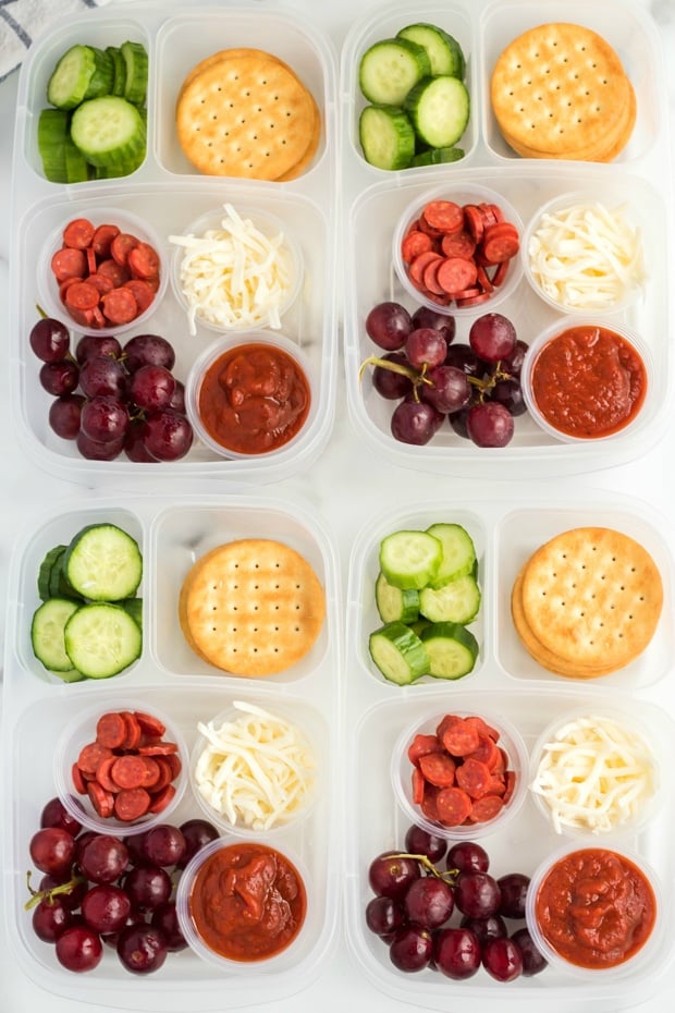 - top down image of 4 DIY Pizza Lunchable lunchboxes