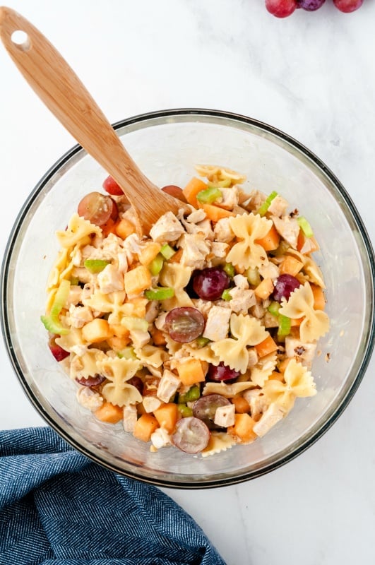 Fresh fruity chicken pasta salad in a glass bowl