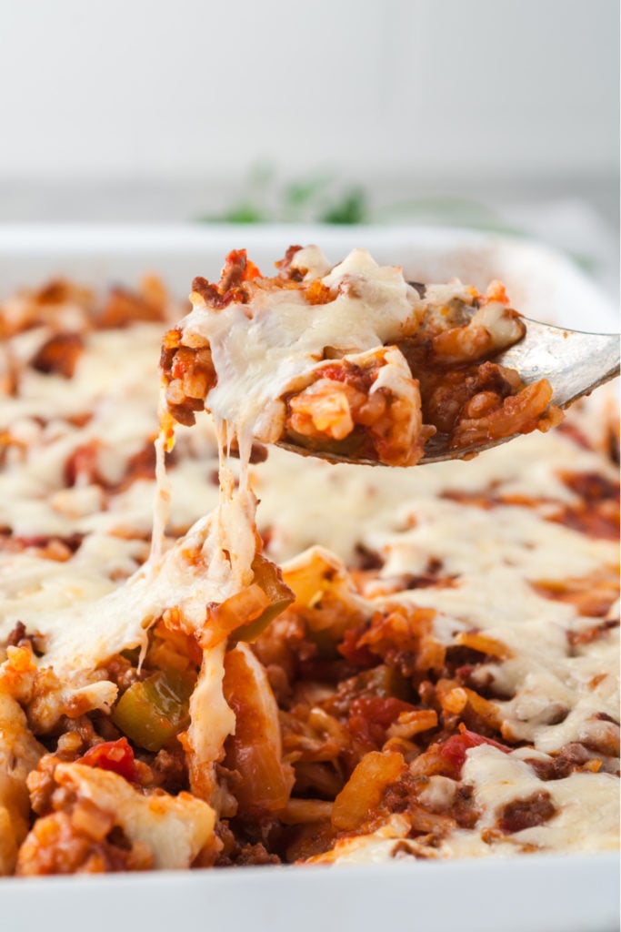 Cabbage Roll Casserole being scooped up with a serving spoon