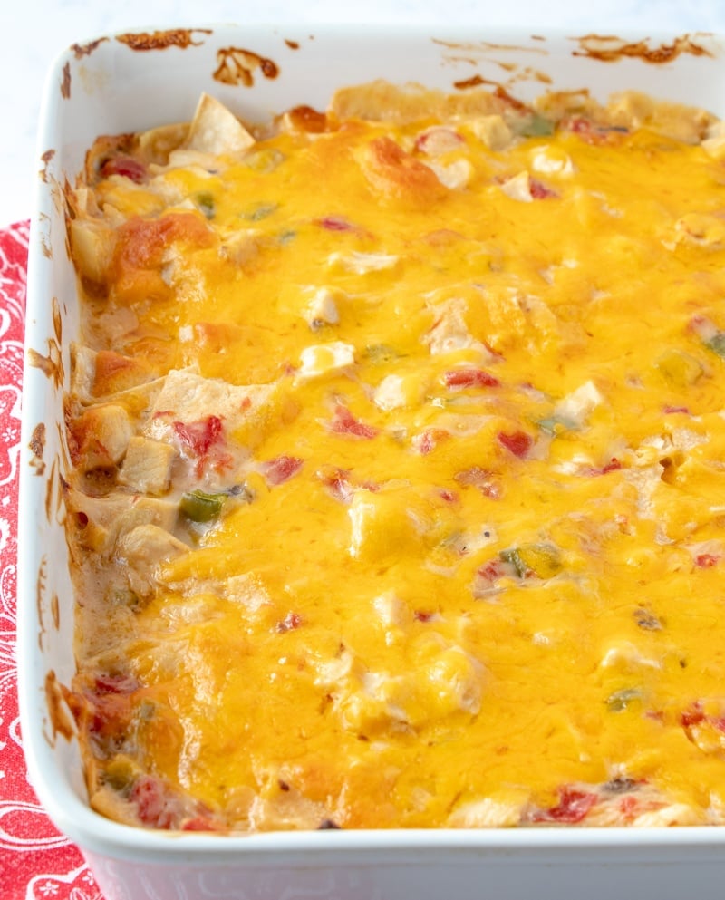 Cooked King Ranch Chicken Casserole in a white baking dish.