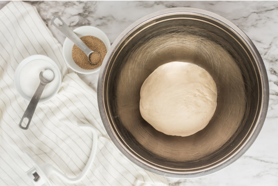 dough ball in a metal mixing bowl