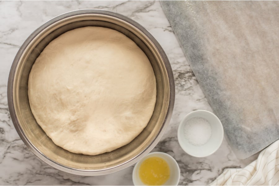 pretzel dough sitting in mixing bowl