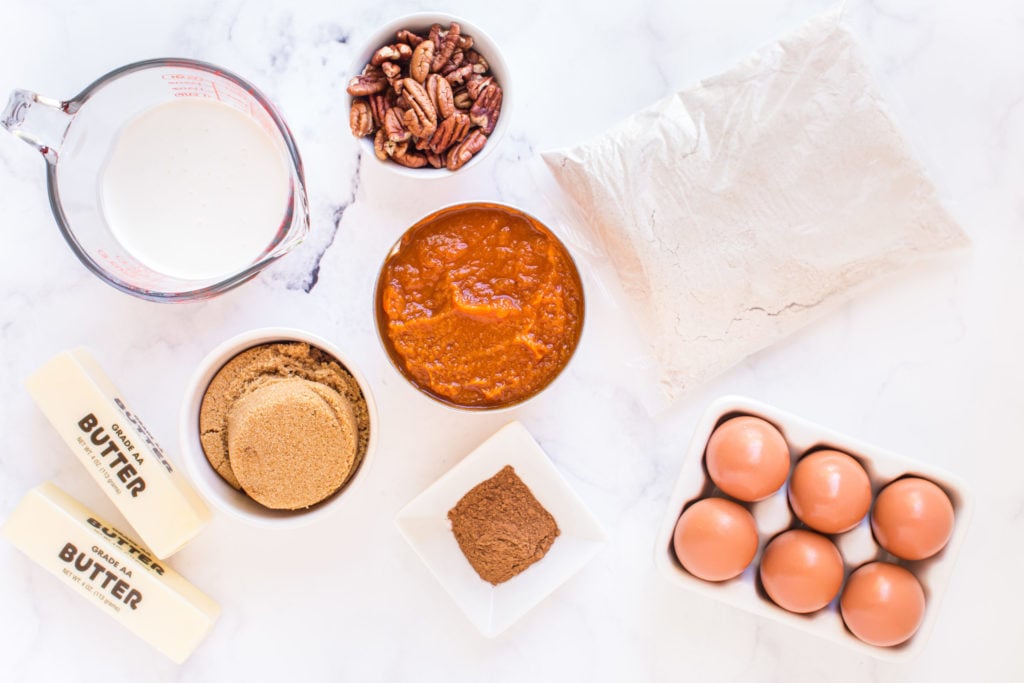 ingredients for pumpkin dump cake on white countertop