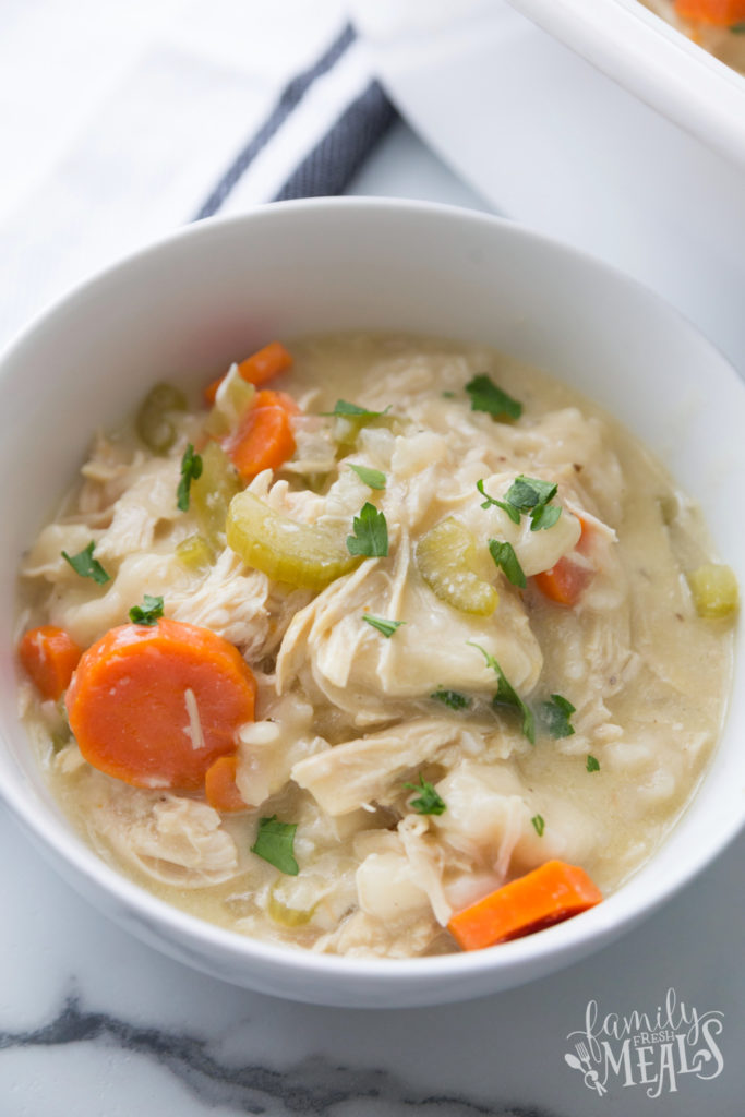 Chicken and dumplings served in a white bowl