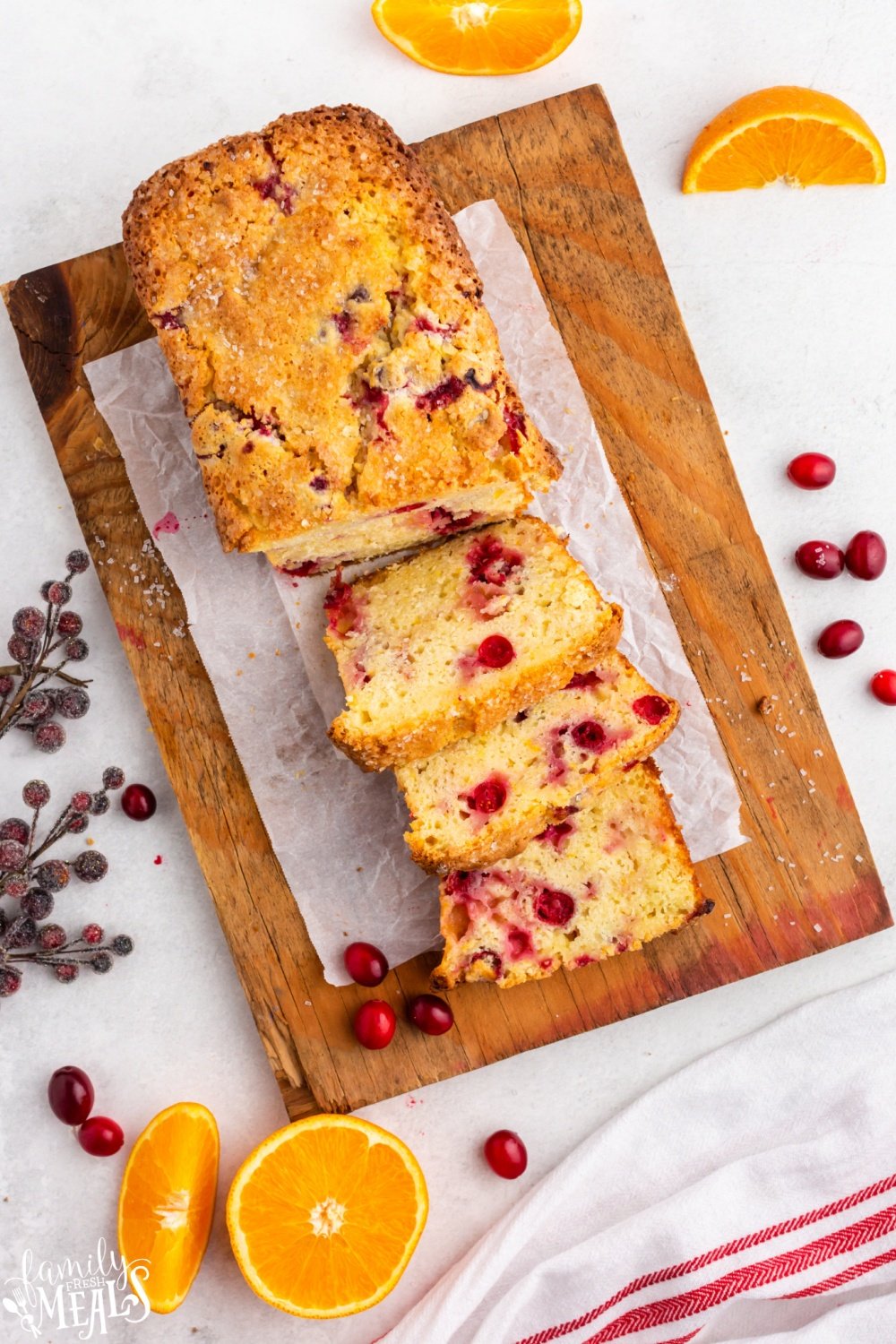 This Cranberry Orange Bread is deliciously rich, moist, and golden. It features the Christmasy flavor combo of sweet oranges and cranberries. via @familyfresh