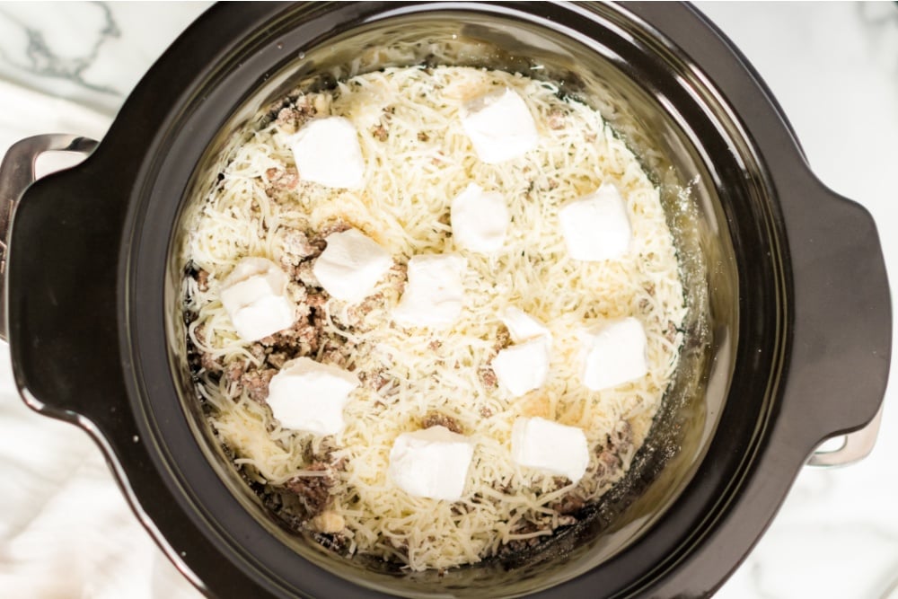 browned beef, Parmesan cheese mozzarella cheese added into slow cooker