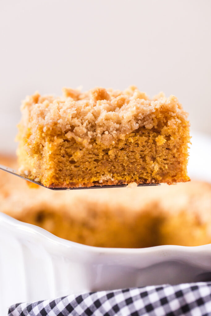 slice of pumpkin coffee cake on a spatula 