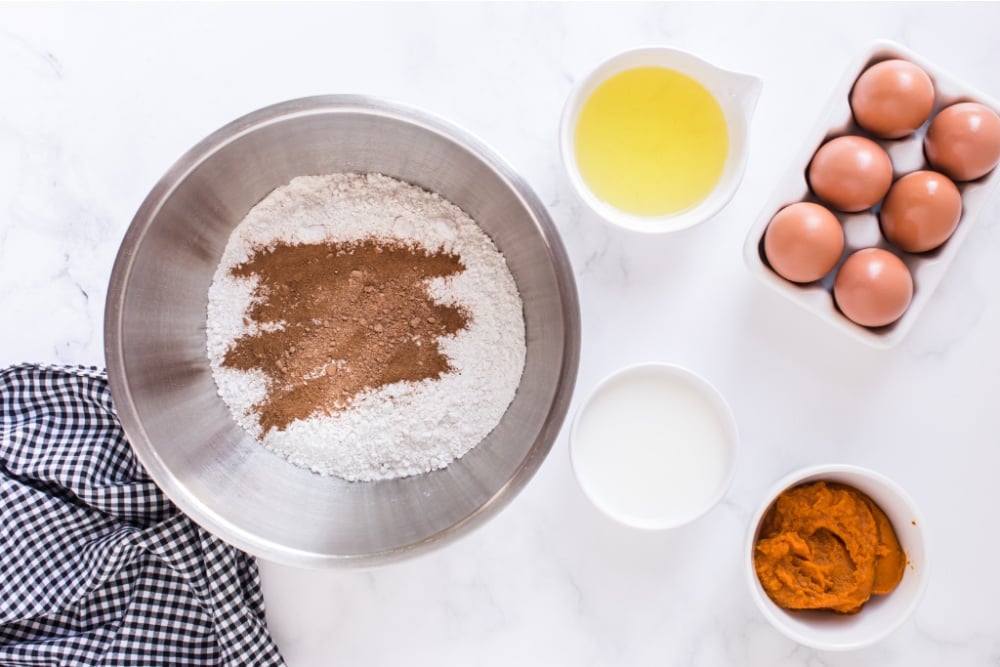 box cake mix, cinnamon, and nutmeg in a mixing bowl