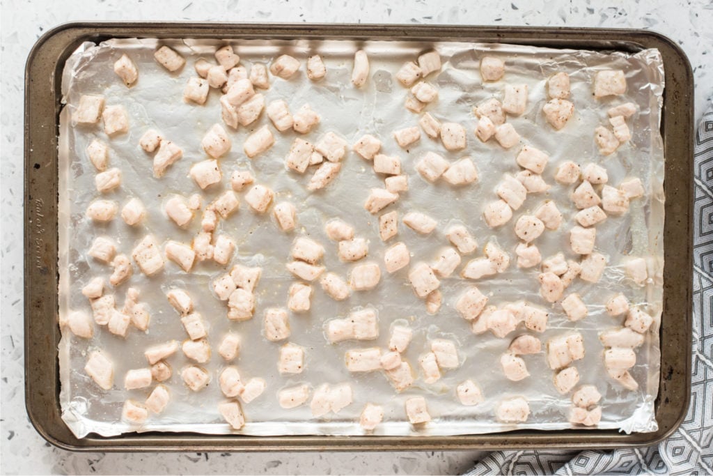 cooked pork pieced on a baking sheet