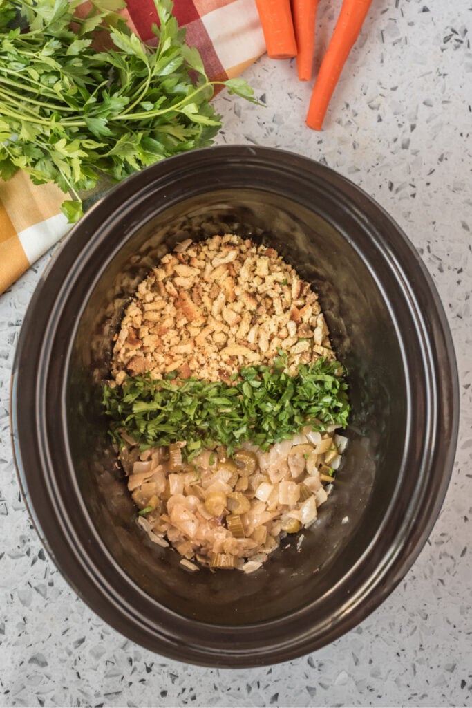 stuffing mix , celery, onion and parsly in the bottom of a slow cooker