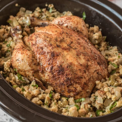 Whole chicken and stuffing in a slow cooker