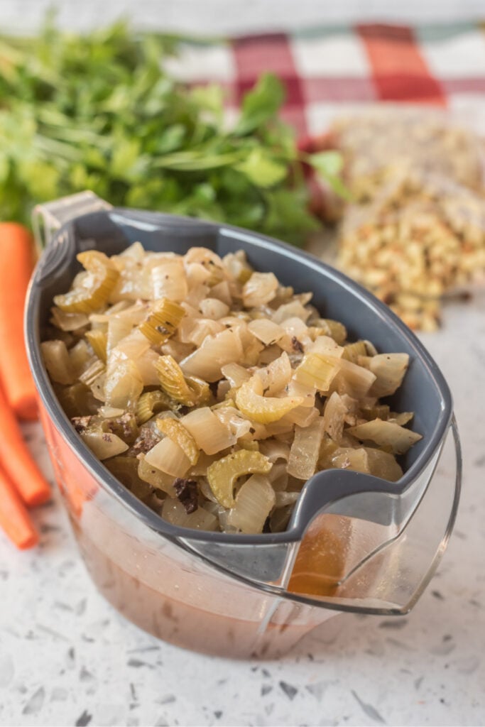 celery and onions in a strainer