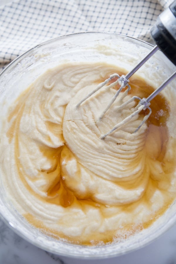 amaretto cake batter being mixing with hand mixer