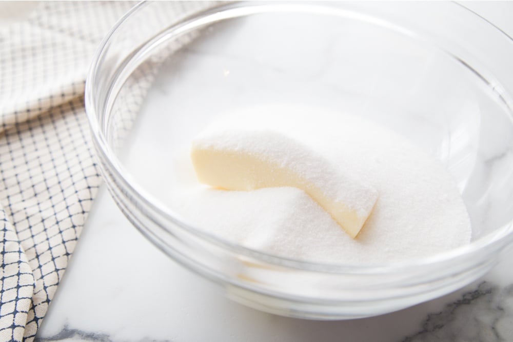 sugar and butter in a glass mixing bowl