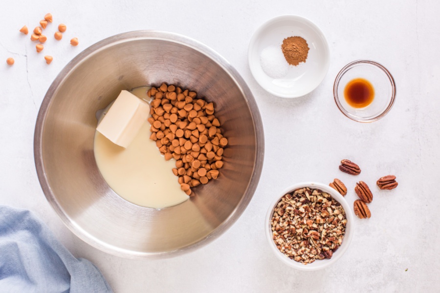 butterscotch chips, sweetened and condensed milk, and butter in a double broiler