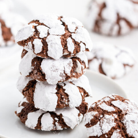 Chocolate Crinkle Cookies stacked on a plate