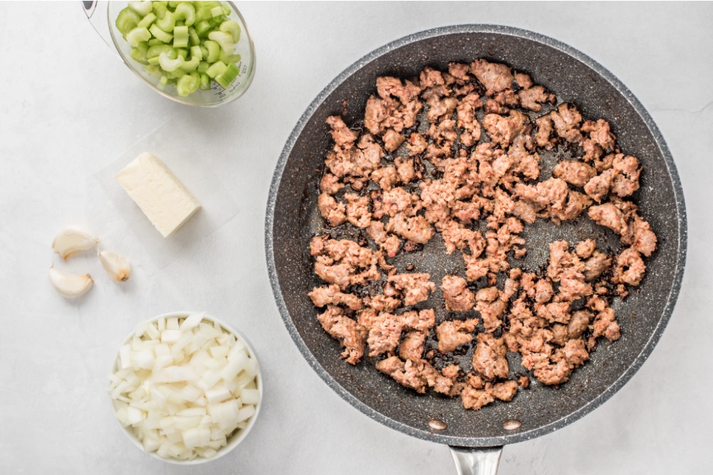 sausage browning in a pan