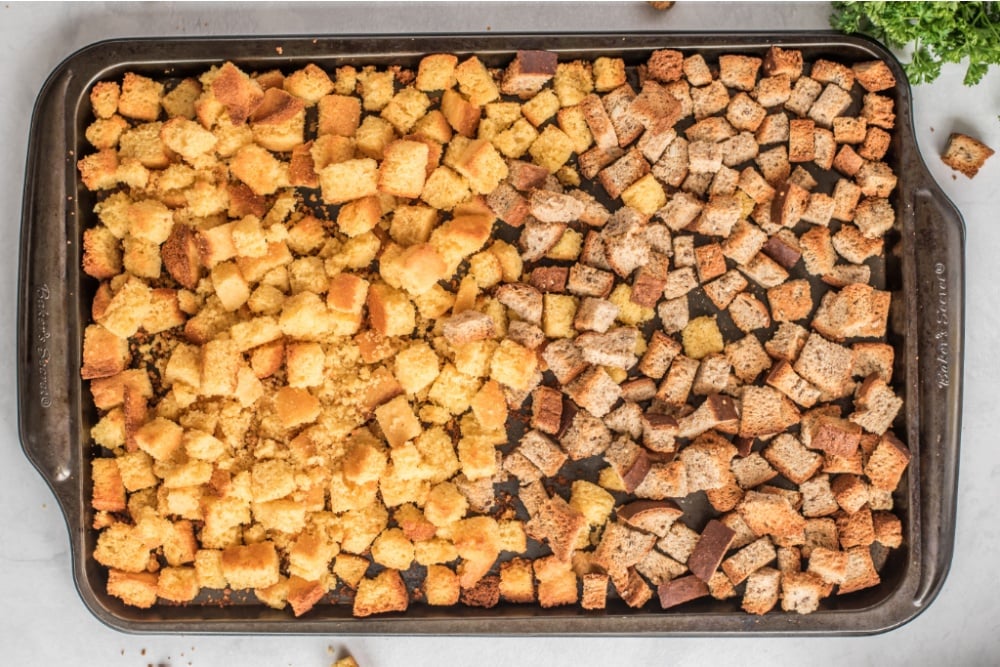 cornbread cubes and 4 cups whole wheat bread cubes and cornbread cubes on a baking sheet