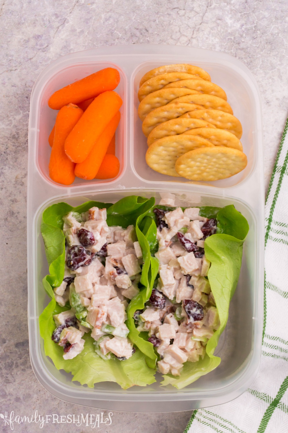 lunchbox packed with turkey salad lettuce cups, baby carrots and carrots