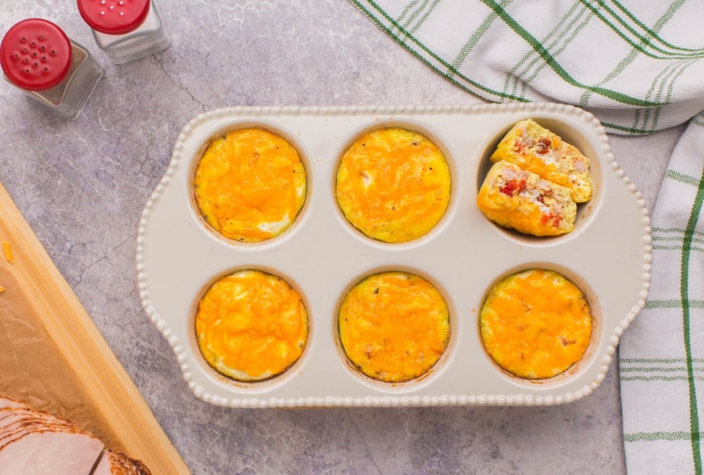 cooked egg cups in a muffin tin