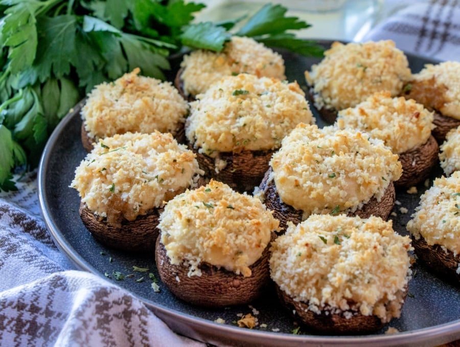 crab stuffed mushrooms on a plate