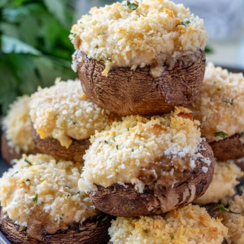 Crab stuffed Mushrooms stacked on a plate