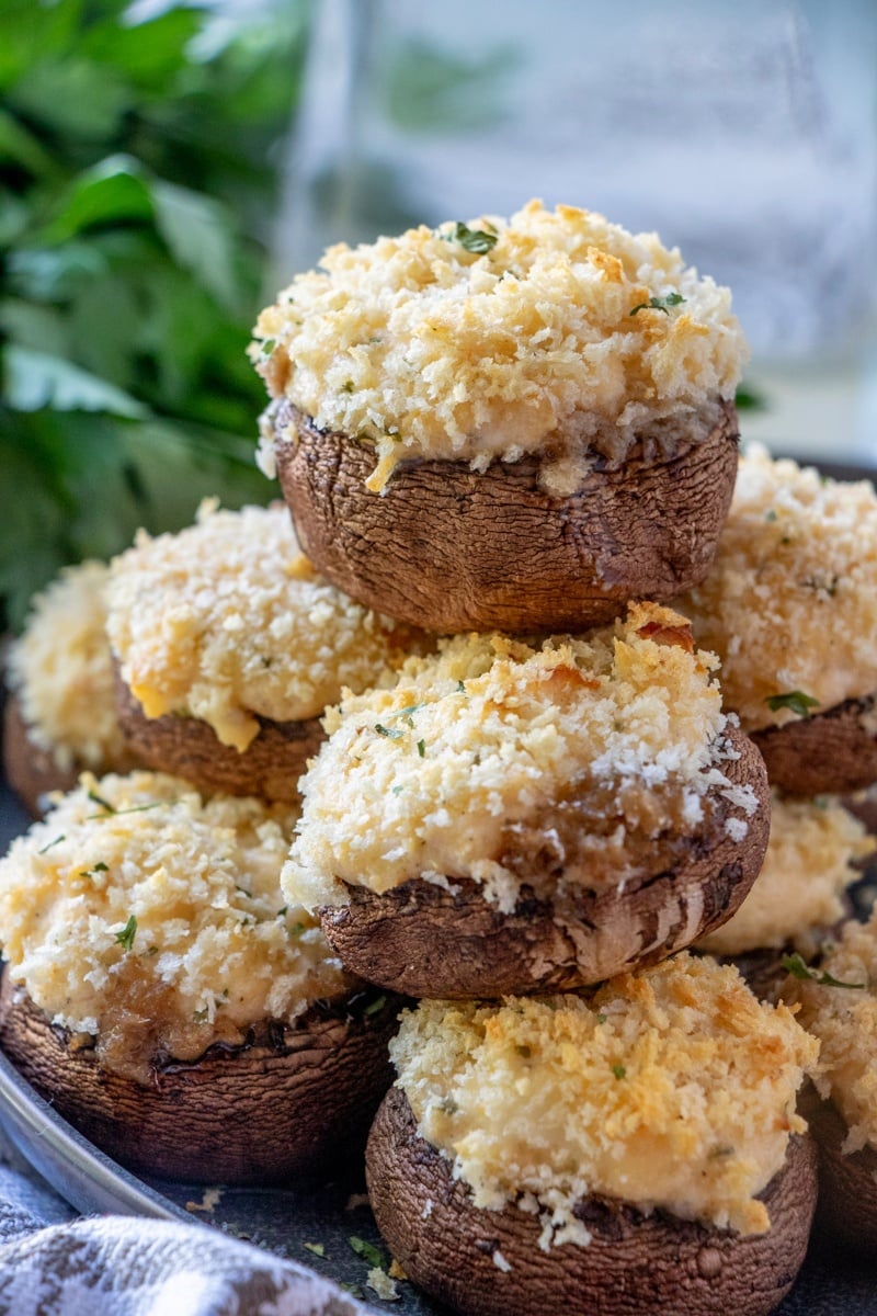 Crab stuffed Mushrooms stacked on a plate