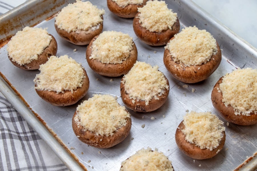 stuffed mushrooms on a baking sheet